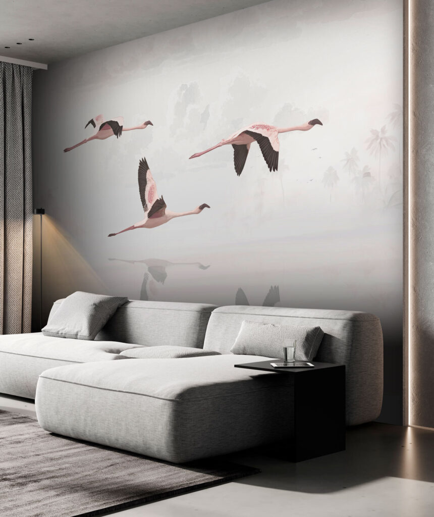 A group of flamingos flying over water