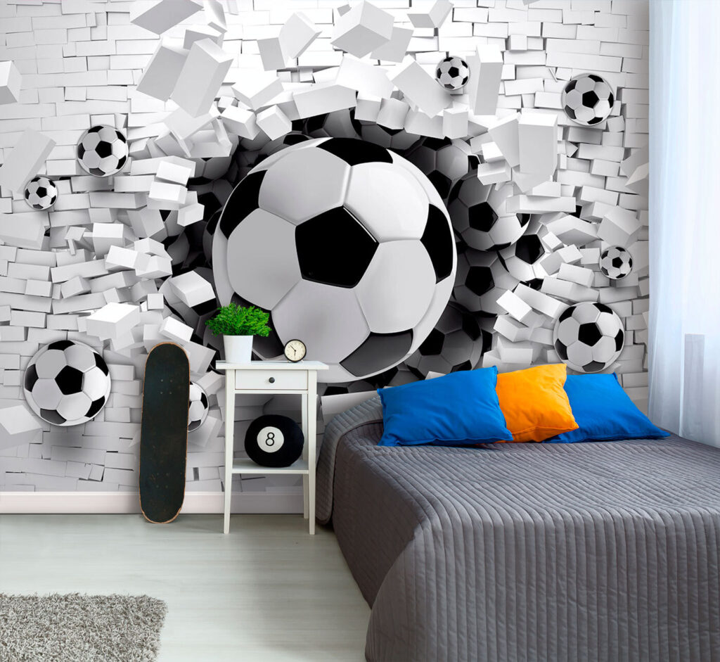 Football ball breaking through a brick wall