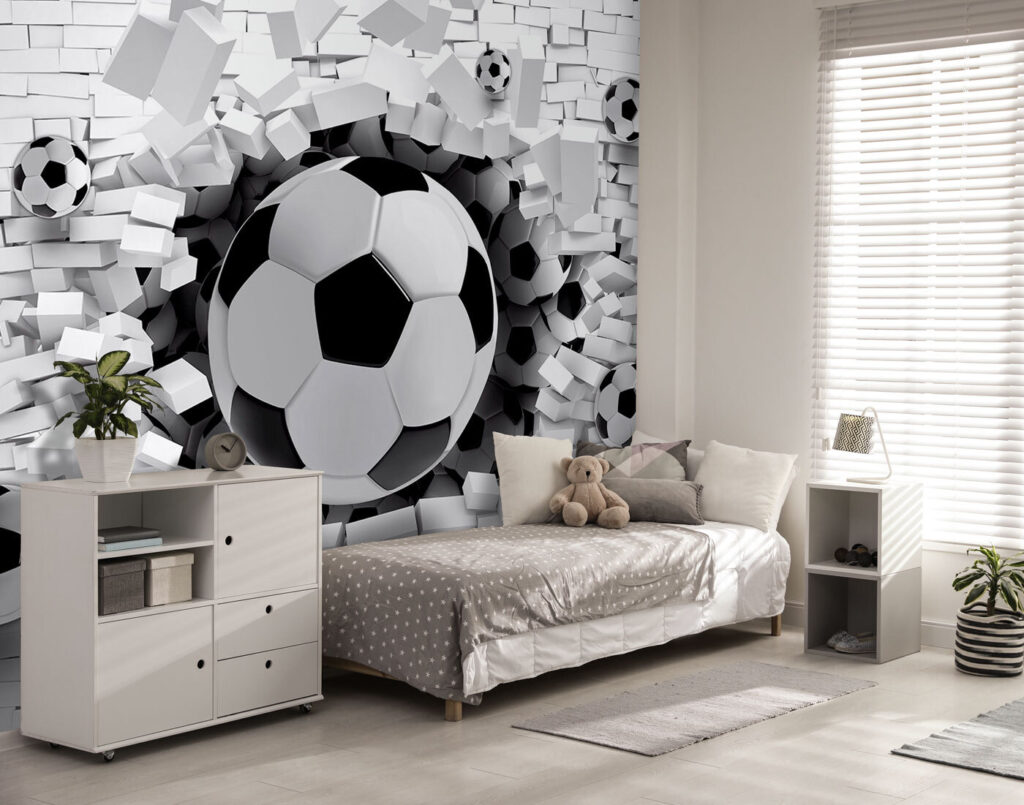 Football ball breaking through a brick wall