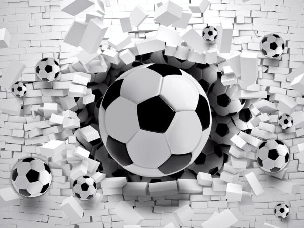 Football ball breaking through a brick wall Football ball breaking through a brick wall