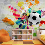 Wall murals Football ball on a brick wall
