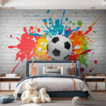 Wall murals Football ball on a brick wall