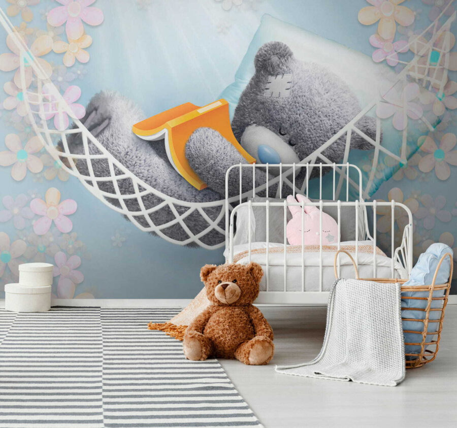 Teddy bear sleeping in a hammock