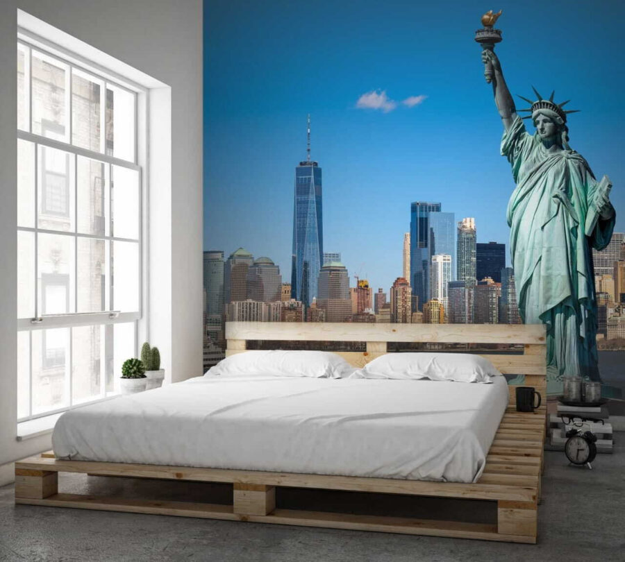Statue of liberty with a city in the background