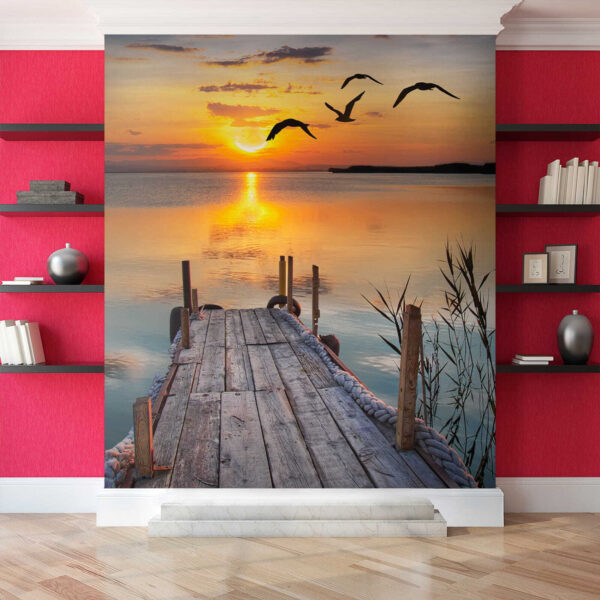 Dock with birds flying over water Dock with birds flying over water