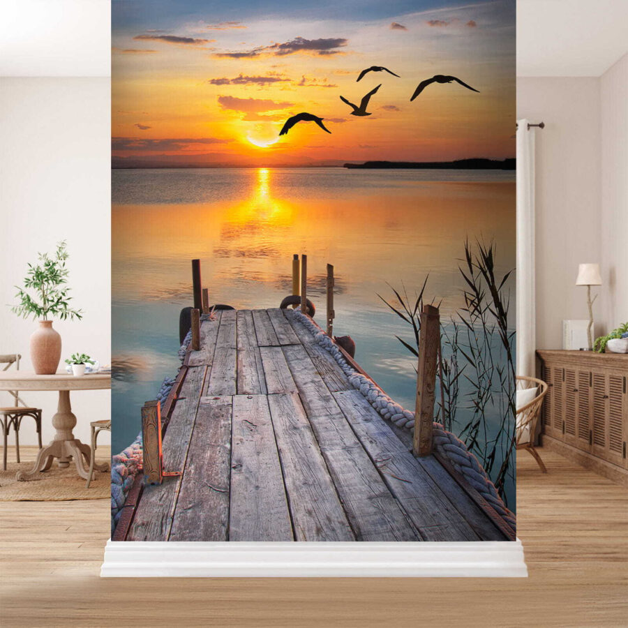 Dock with birds flying over water