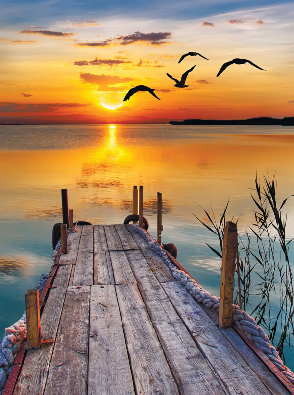 Dock with birds flying over water Dock with birds flying over water
