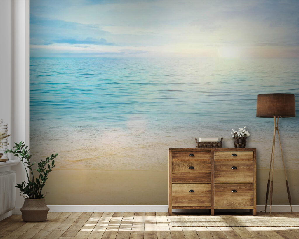 Sandy beach with blue water and a blue sky