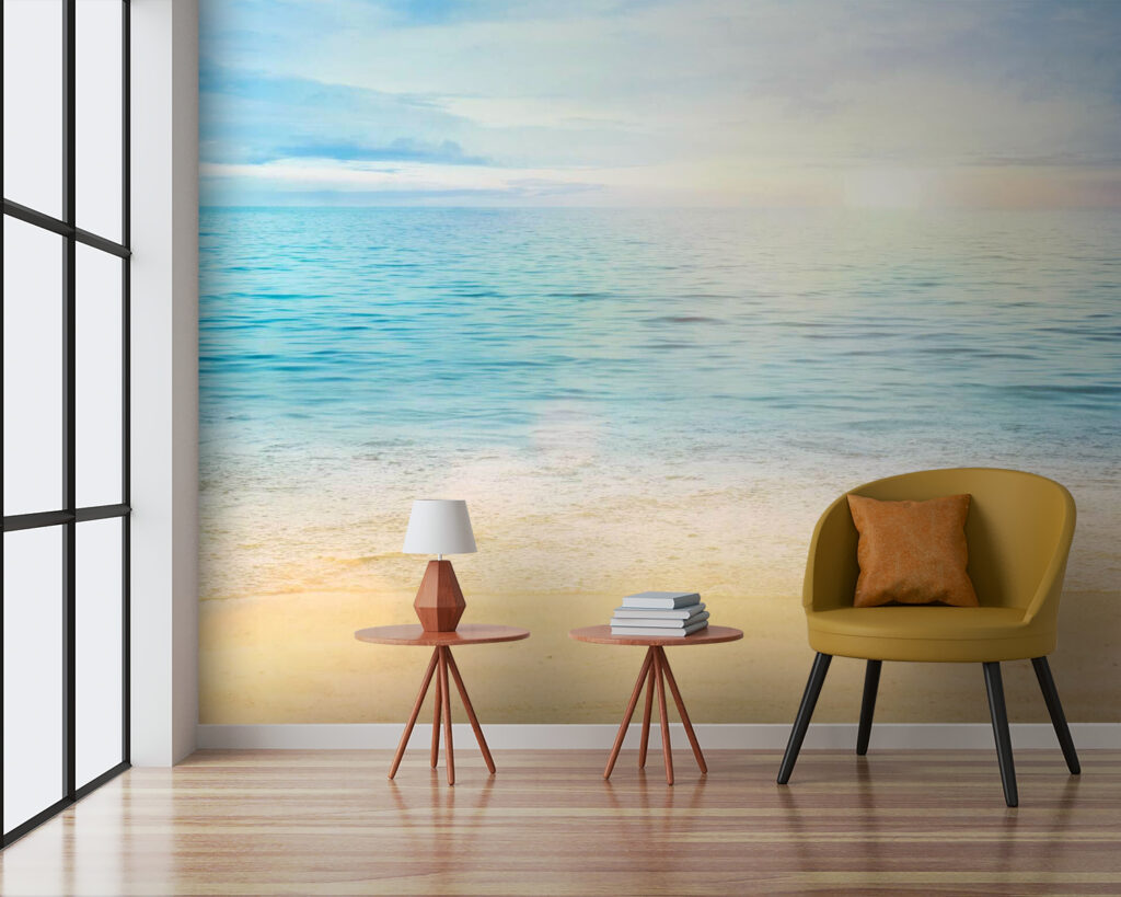 Sandy beach with blue water and a blue sky