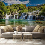 Wall murals Krka National Park surrounded by trees and a blue sky