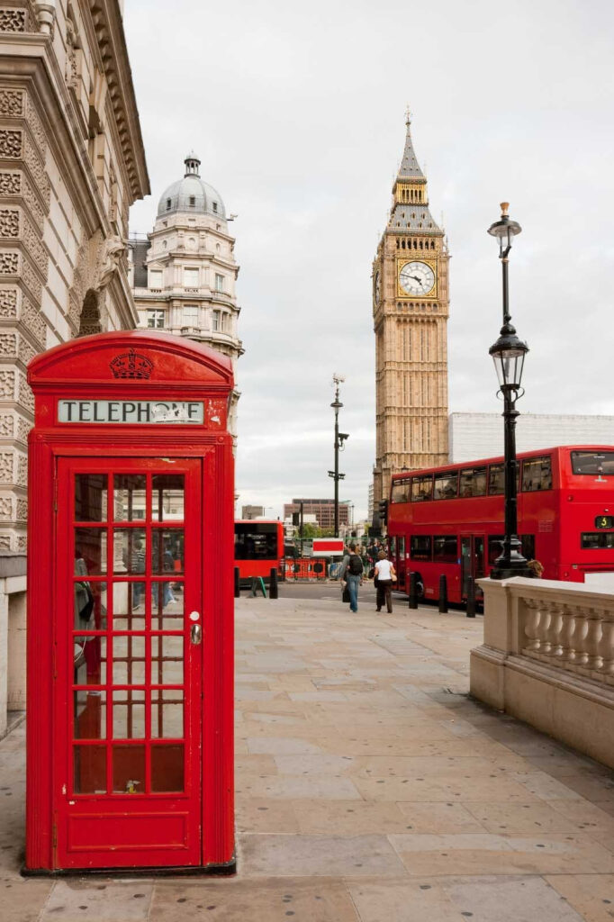 Red telephone booth in a city Red telephone booth in a city
