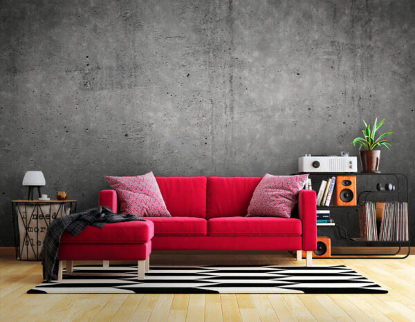 Grey concrete wall with black spots Grey concrete wall with black spots