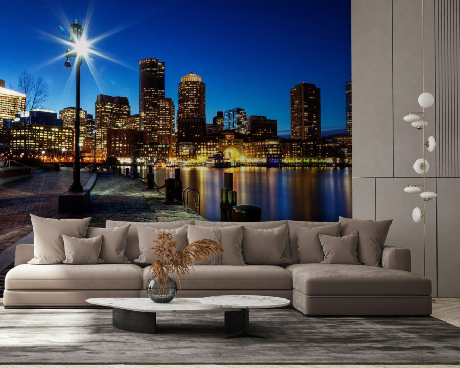City skyline at night with a body of water