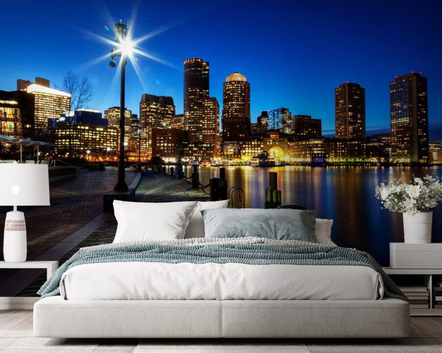 City skyline at night with a body of water