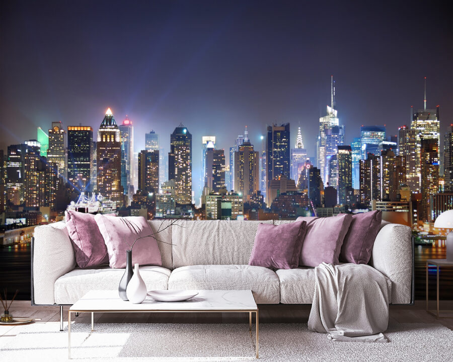 City skyline at night with lights reflecting on water