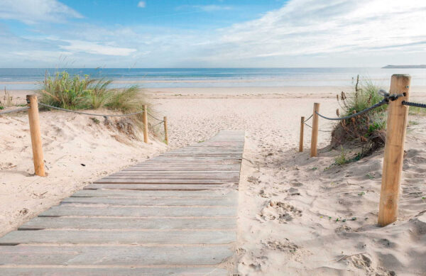 Wooden walkway leading to a beach Wooden walkway leading to a beach