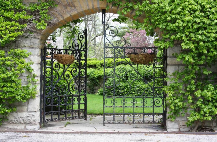Wall murals Gate with a stone arch and a green lawn - Image 4