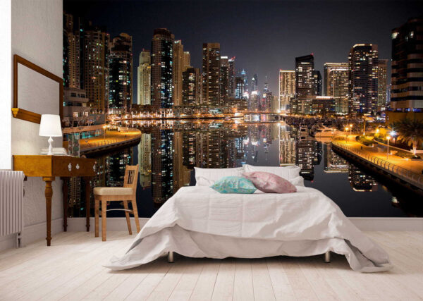 City skyline with lights reflecting on water City skyline with lights reflecting on water