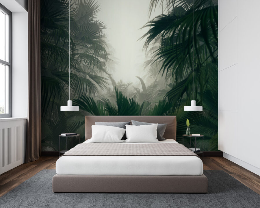 Group of palm trees in a foggy forest