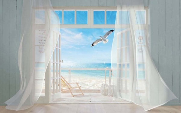 View of a beach from a room with a bird flying over it View of a beach from a room with a bird flying over it