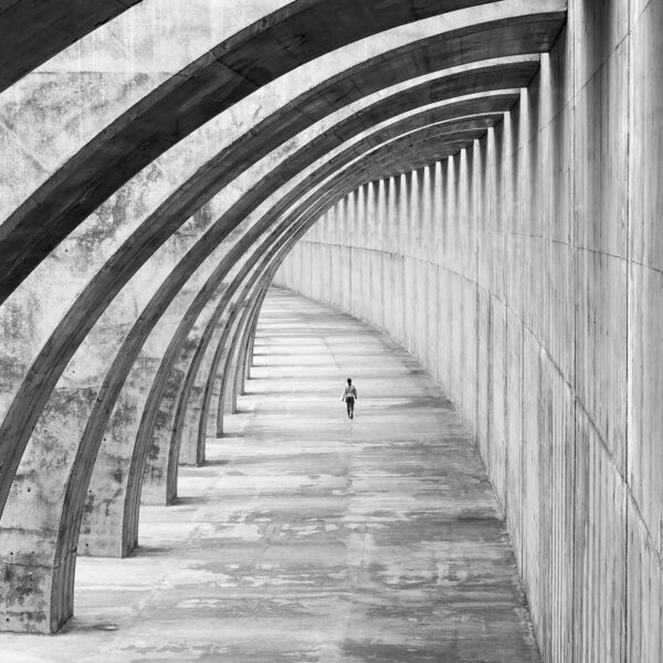 Person running in a tunnel Person running in a tunnel