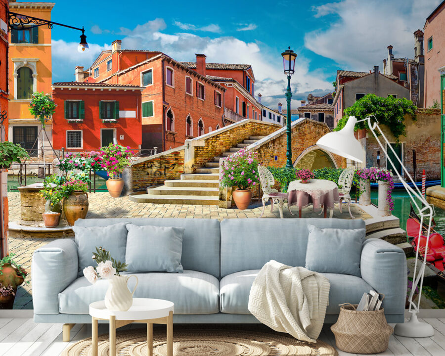 Patio with a table and chairs and a fountain in front of a building