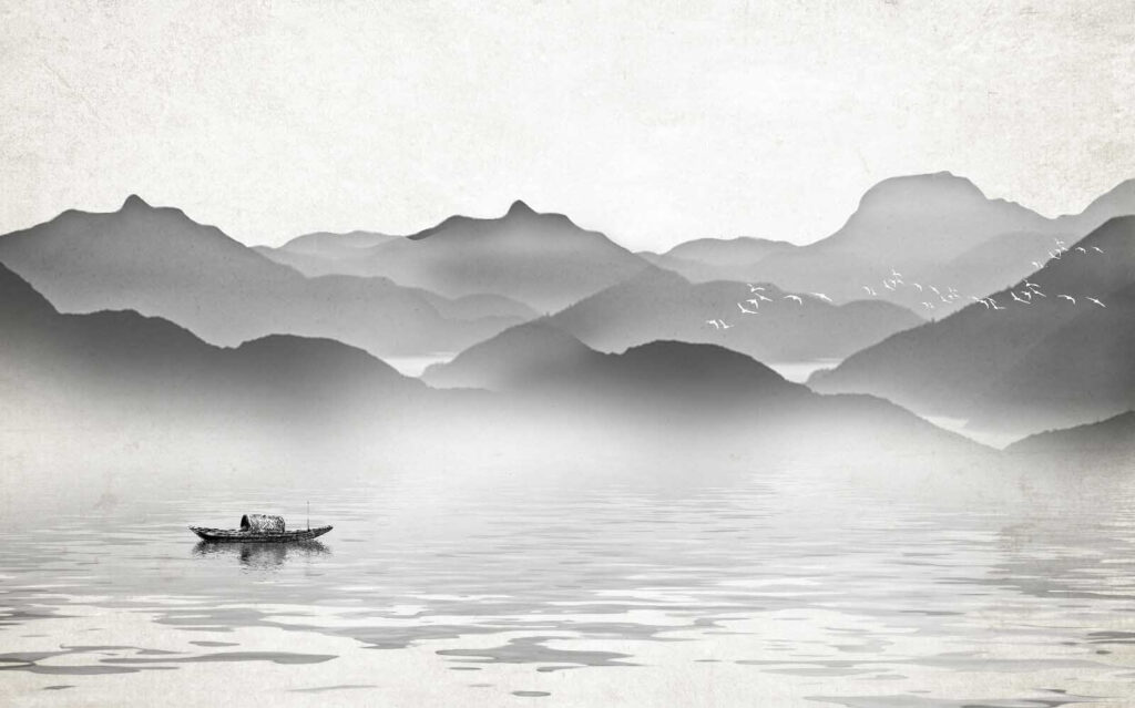 Boat on water with mountains in the background Boat on water with mountains in the background