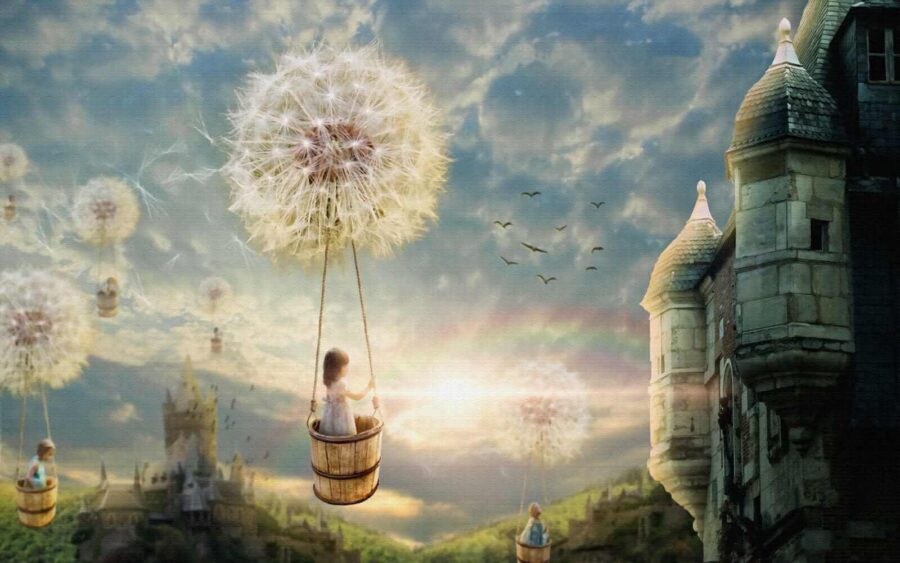 Girl in a basket on a swing with a dandelion in the sky