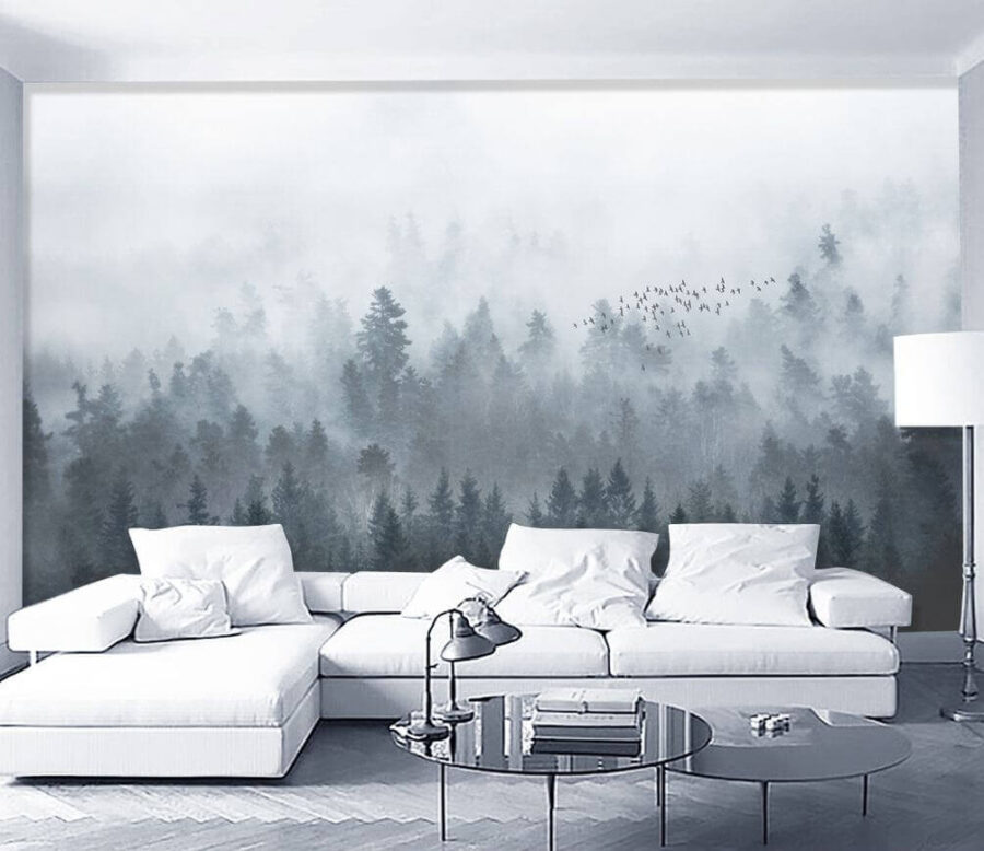 Group of birds flying over a forest
