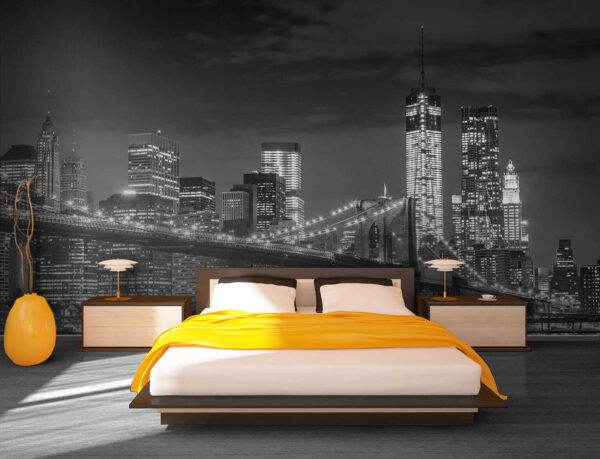 Bridge over water with city skyline at night