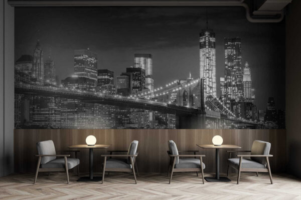 Bridge over water with city skyline at night