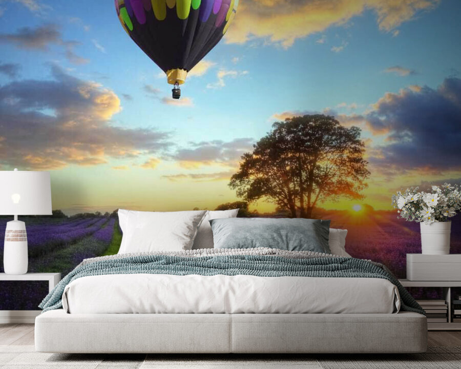 Group of hot air balloons flying over a field of flowers