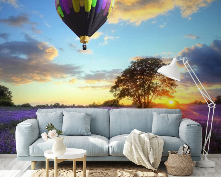 Group of hot air balloons flying over a field of flowers