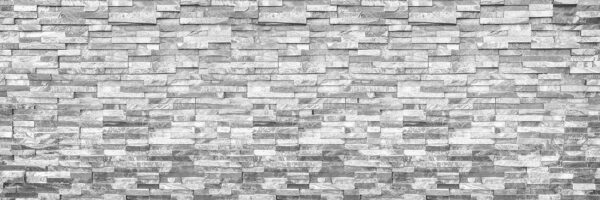 Textured stone wall in monochrome design. Textured stone wall in monochrome design.