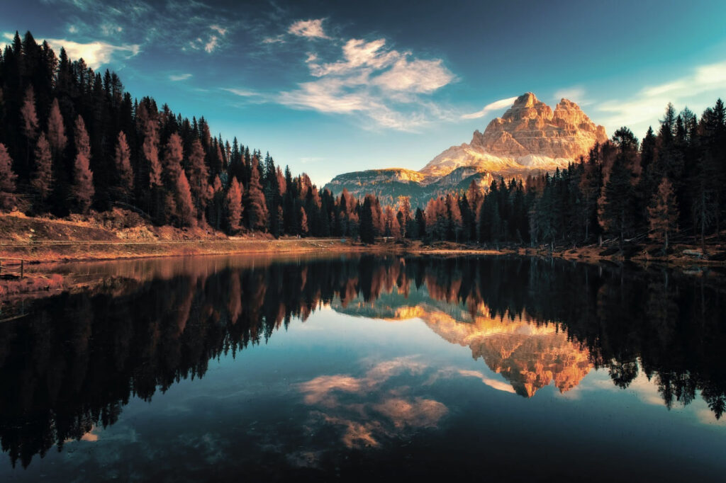 Lake surrounded by trees and mountains Lake surrounded by trees and mountains