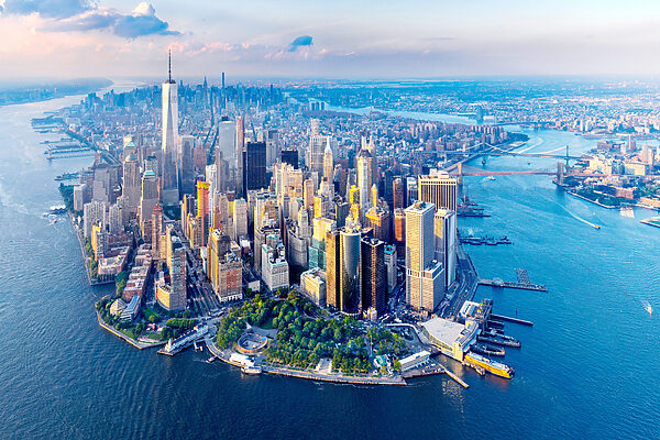 A city with many tall buildings and a body of water A city with many tall buildings and a body of water