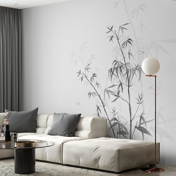 A white couch with a black coffee table and a white wall with a bamboo design