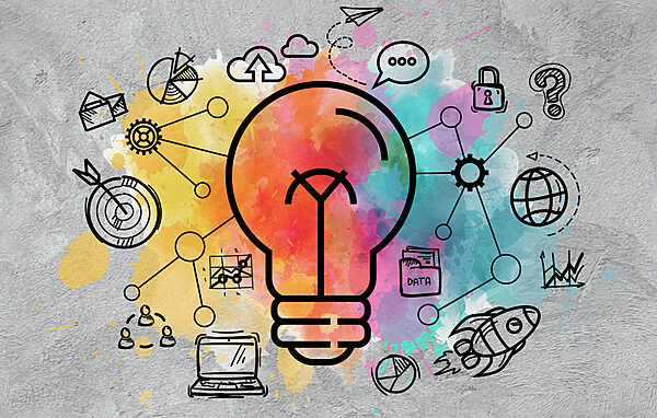 A light bulb with a colorful background A light bulb with a colorful background