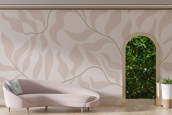 A desk and chair in a room with a wallpaper