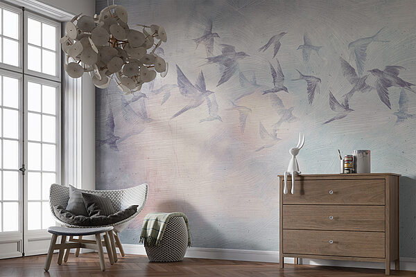 A flock of birds flying in the sky