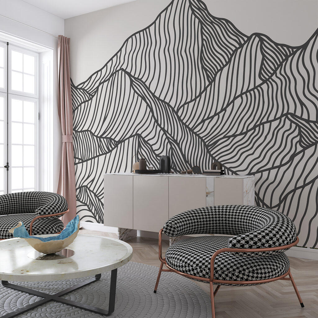 A black and white drawing of a mountain range