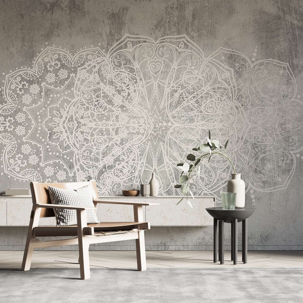 White ornate design on a grey surface