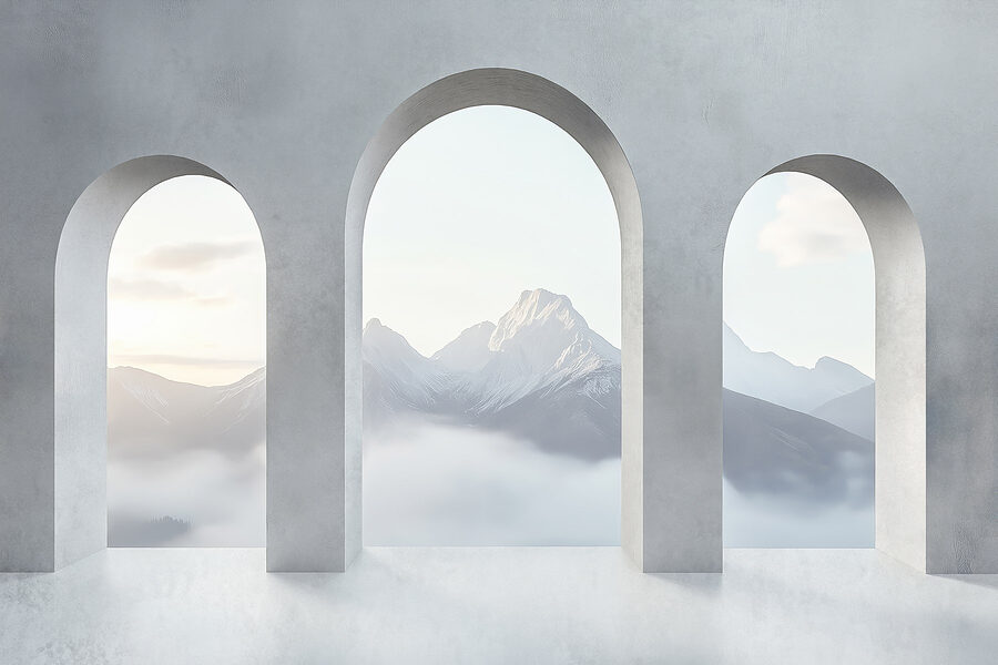 White room with arched windows and mountains in the background