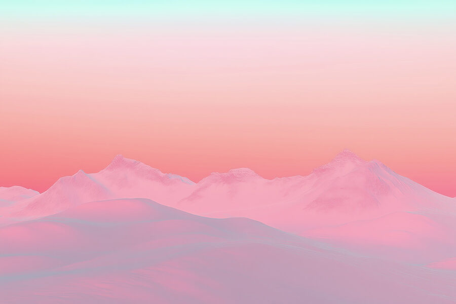 Pink and blue sky over a snowy mountain range