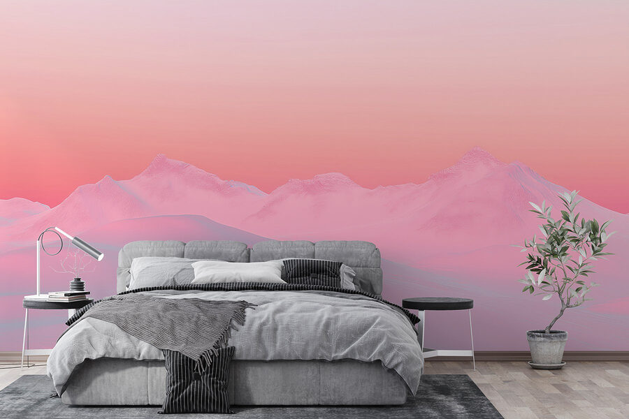 Pink and blue sky over a snowy mountain range