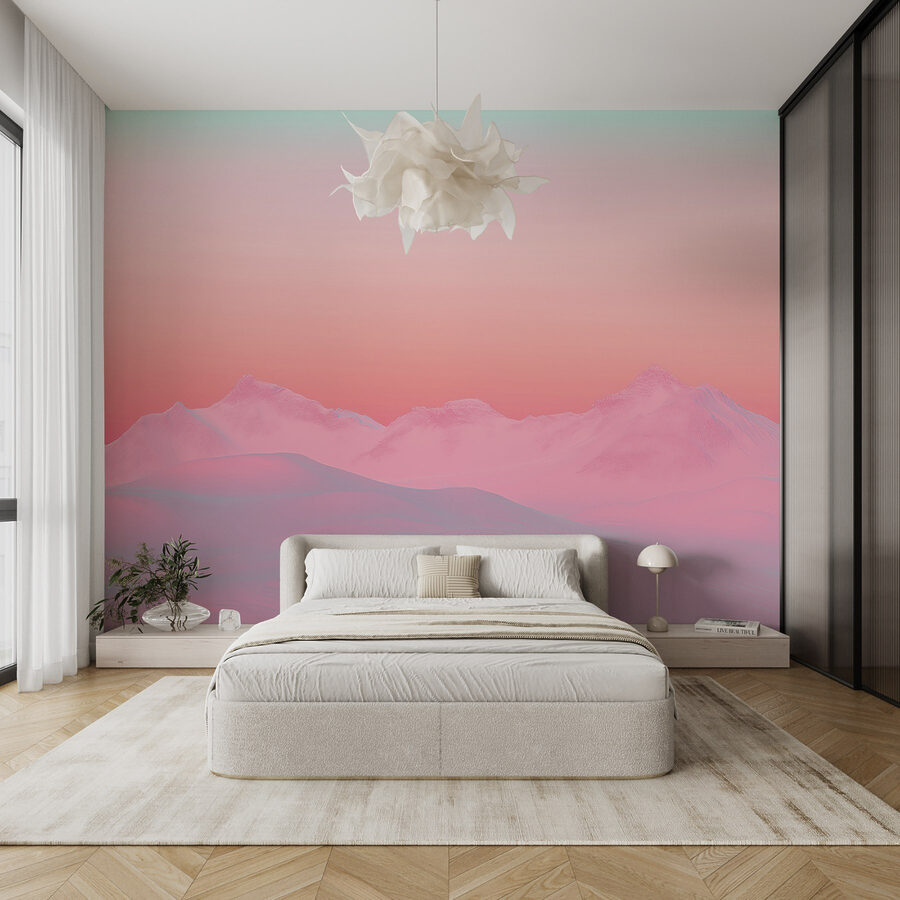 Pink and blue sky over a snowy mountain range