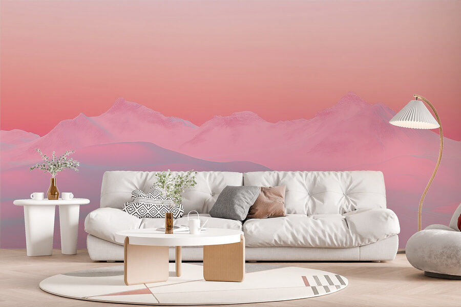 Pink and blue sky over a snowy mountain range