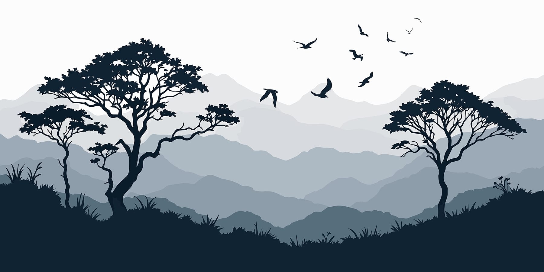 Birds flying over a mountain range