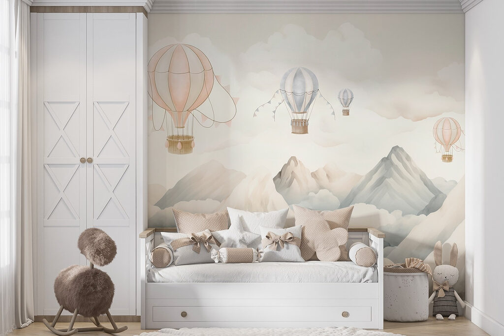 Group of hot air balloons in the sky above mountains