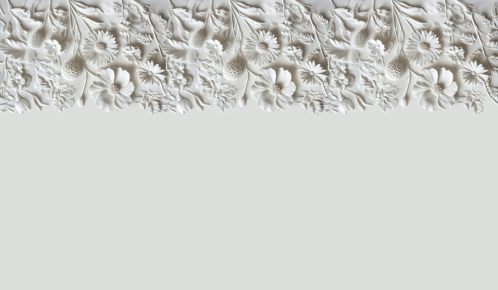 White floral design on a wall White floral design on a wall